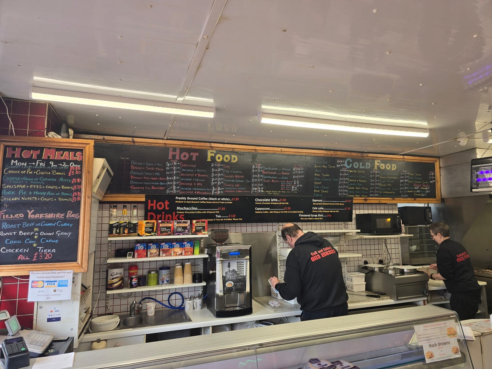 The Woodside Stores sandwich counter and handwritten hot and cold menu boards